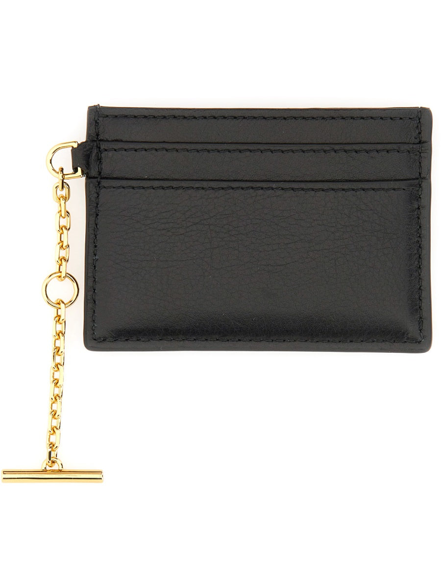 Close-up of Alexander McQueen wallets hardware and fine stitching