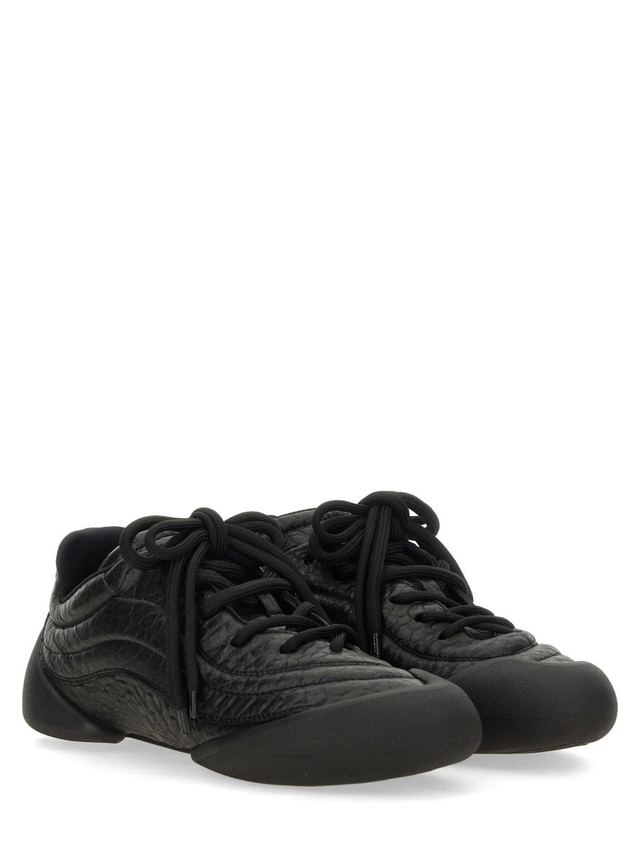 Alexander McQueen premium athletic detail and craftsmanship close-up