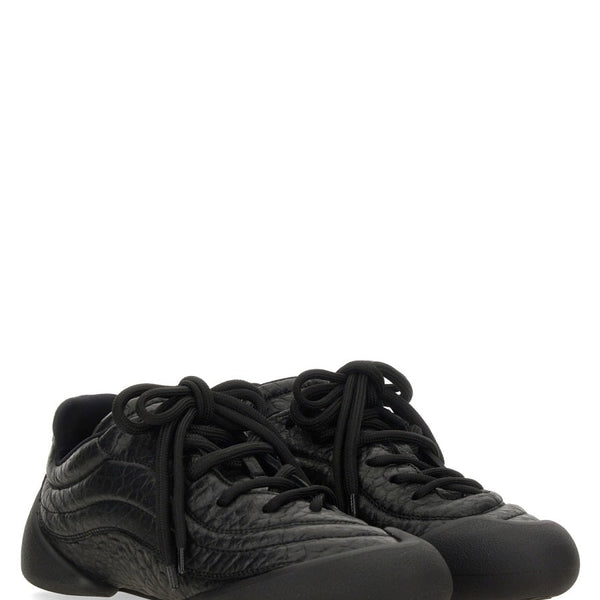 Alexander McQueen premium athletic detail and craftsmanship close-up