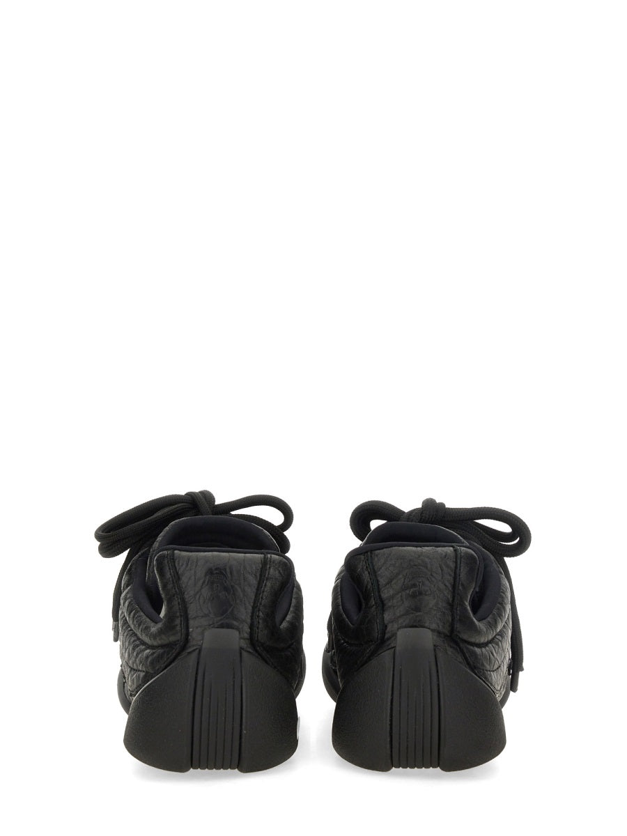 Alexander McQueen athletic side profile designer luxury fashion