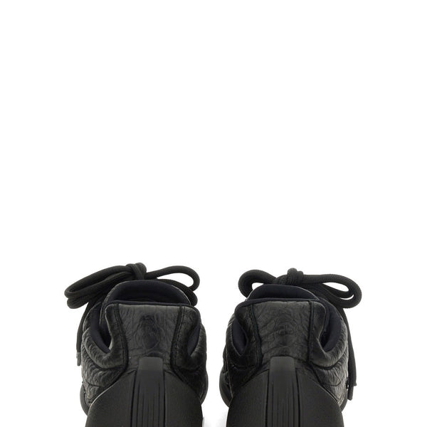Alexander McQueen athletic side profile designer luxury fashion