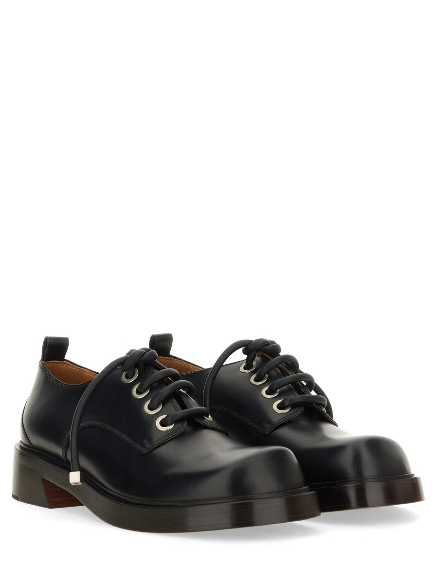 Alexander McQueen premium athletic detail and craftsmanship close-up