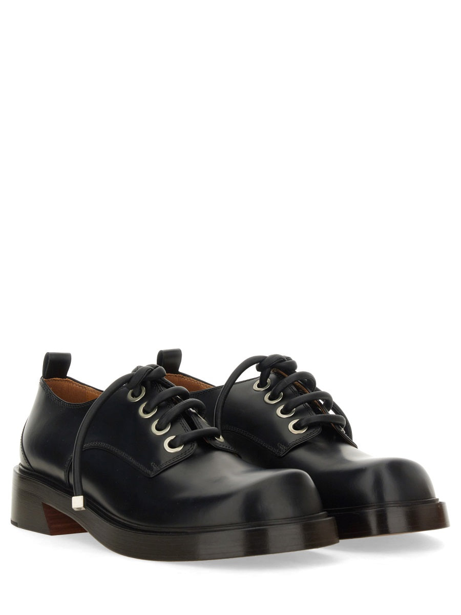 Close-up of Alexander McQueen athletic hardware and fine stitching