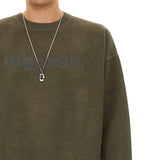 Close-up of Alexander McQueen sweaters & pullovers hardware and fine stitching