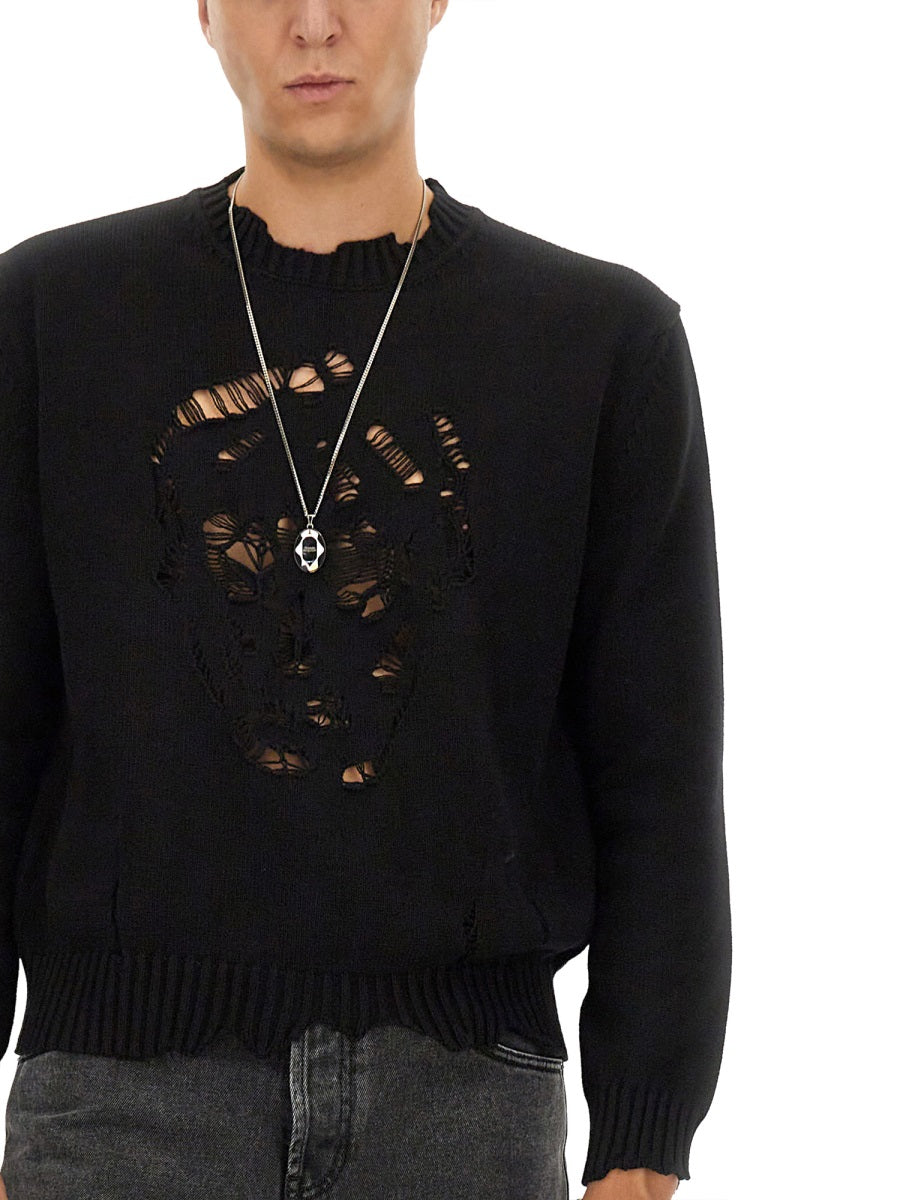 Close-up of Alexander McQueen sweaters & pullovers hardware and fine stitching