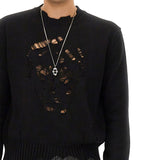 Close-up of Alexander McQueen sweaters & pullovers hardware and fine stitching