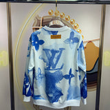 Side profile of Louis Vuitton luxury clothing with signature branding