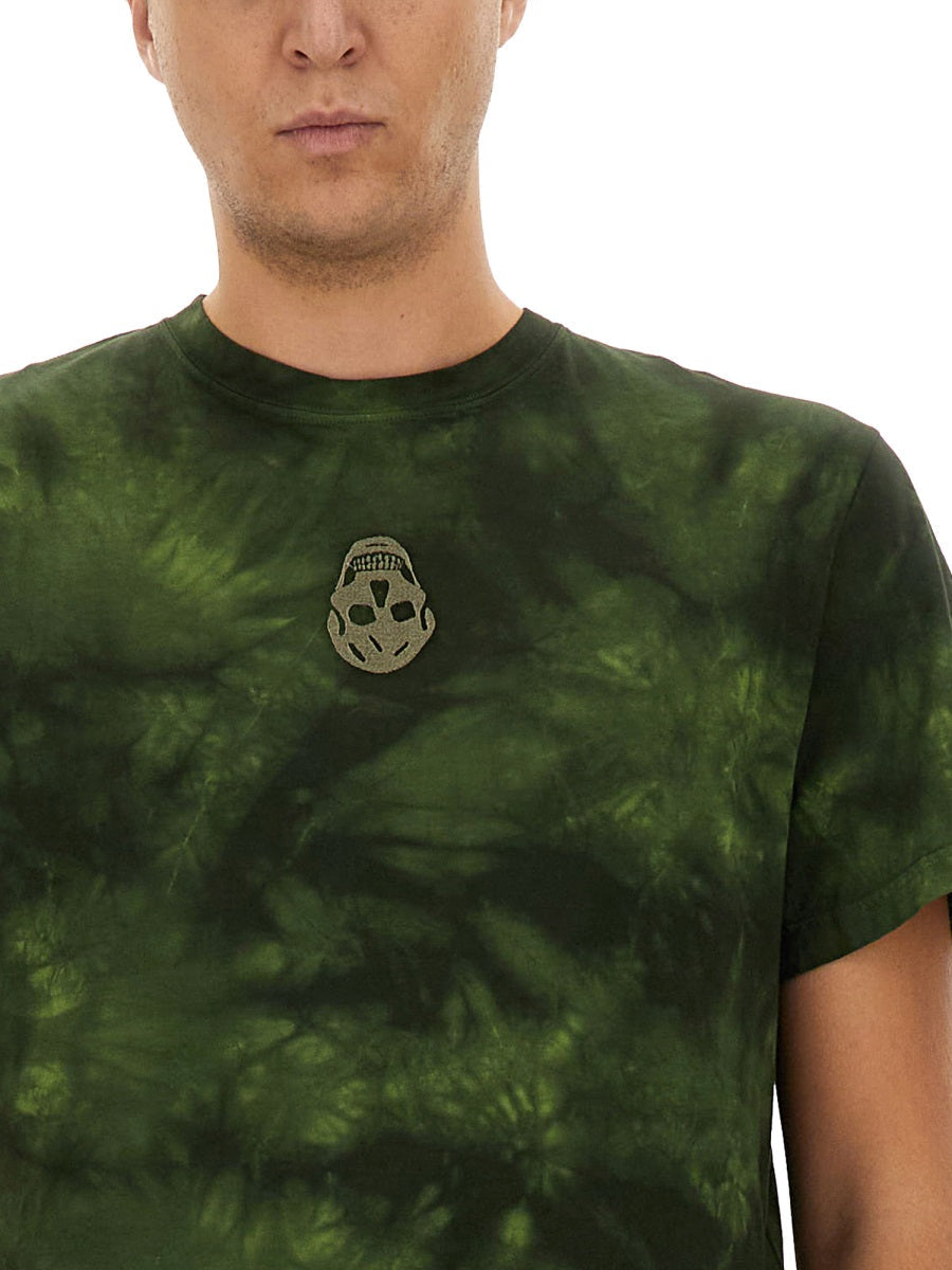 Close-up of Alexander McQueen tee shirts hardware and fine stitching