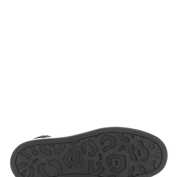 Close-up of Alexander McQueen athletic hardware and fine stitching