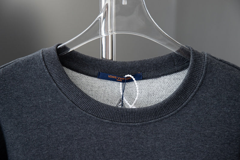 Close-up detail shot of Louis Vuitton luxury clothing with relaxed-fit cut