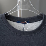 Close-up detail shot of Louis Vuitton luxury clothing with relaxed-fit cut
