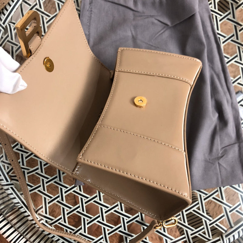 Front view of modern sleek women's handbag – women's luxury accessory