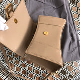Front view of modern sleek women's handbag – women's luxury accessory