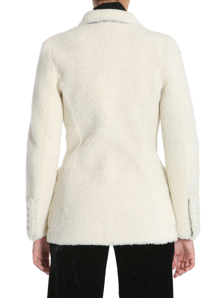 Close-up of Alexander McQueen coats hardware and fine stitching