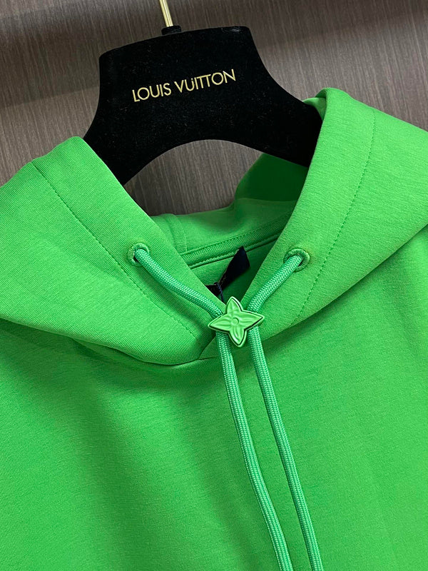 Close-up detail shot of Louis Vuitton luxury clothing with logo-detail design