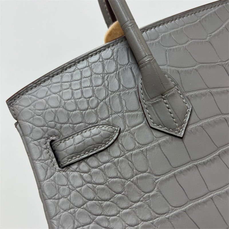 Side view of refined structured handbag