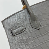 Side view of refined structured handbag