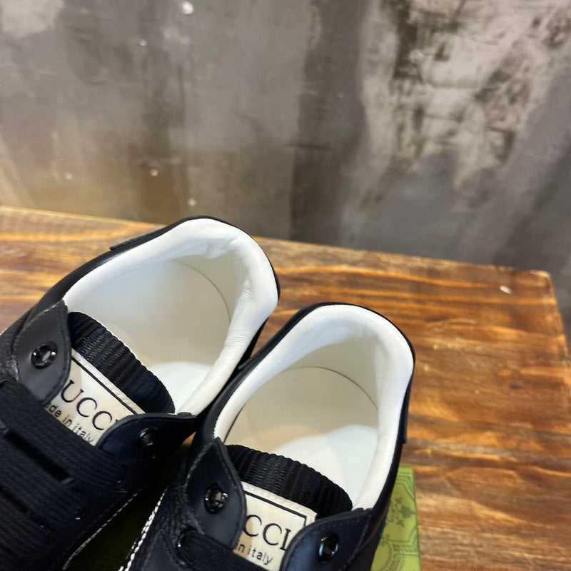 Side profile of Gucci tonal black sneakers bold athletic profile