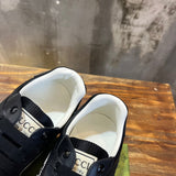 Side profile of Gucci tonal black sneakers bold athletic profile