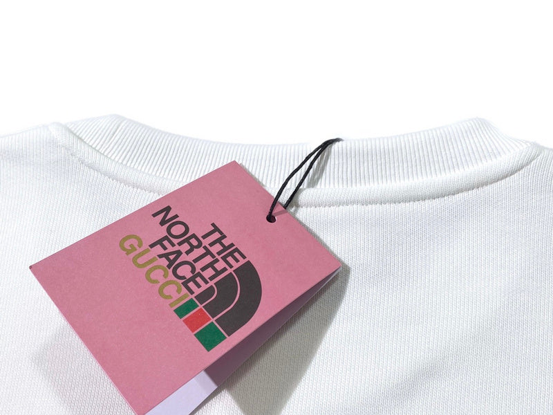 Flat lay presentation of Gucci luxury clothing with relaxed-fit cut