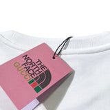 Flat lay presentation of Gucci luxury clothing with relaxed-fit cut