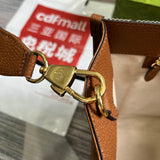Styled lifestyle shot of signature statement women's handbag – women's designer-style accessory
