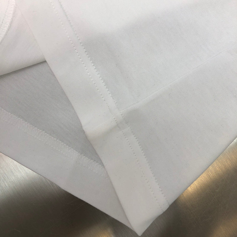 Flat lay presentation of Louis Vuitton cotton t-shirt with label-forward styling