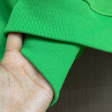 Close-up detail shot of Louis Vuitton luxury clothing with logo-detail design