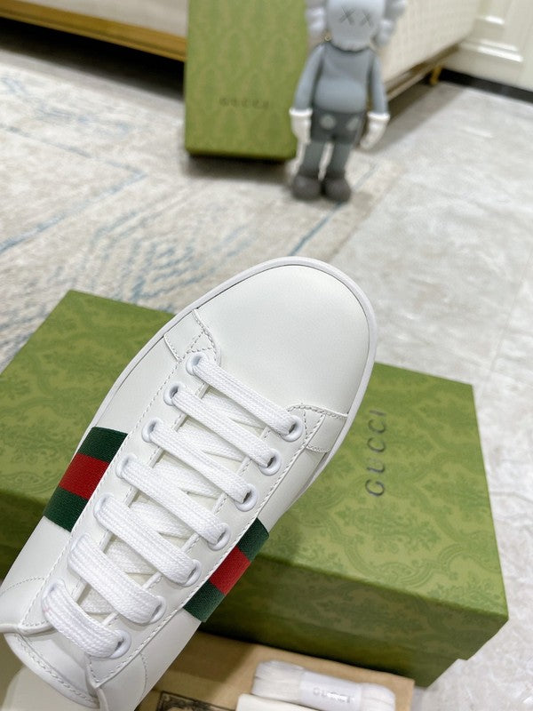 Side profile of Gucci fresh white-and-black sneakers streetwear statement look
