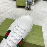 Side profile of Gucci fresh white-and-black sneakers streetwear statement look