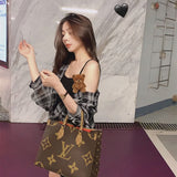  Tailored crossbody bag carried on shoulder 34