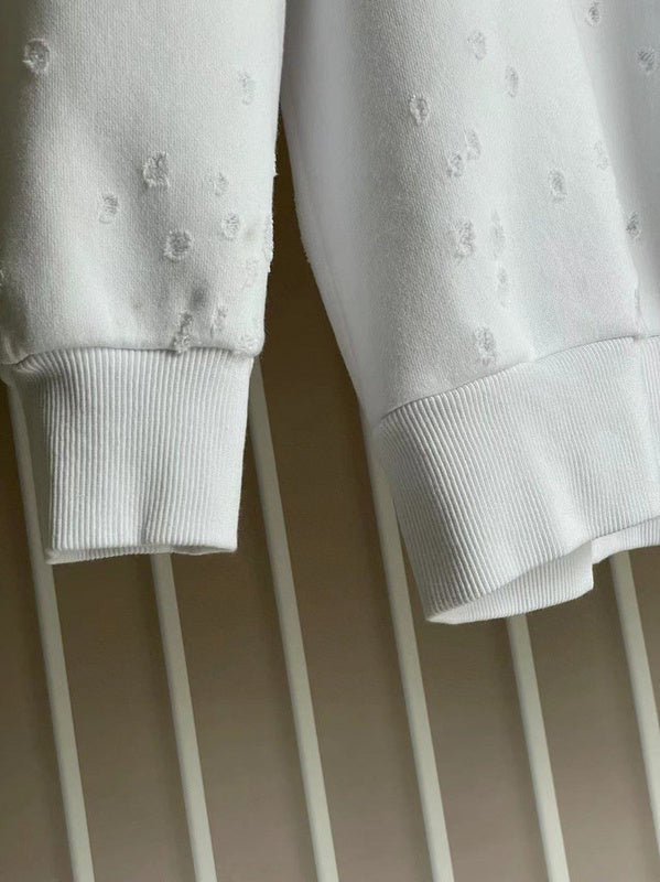 Texture and finish detail of Givenchy luxury piece style No.112