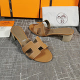 Hermès White Flat Thong Sandals - Angled View