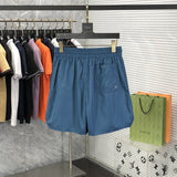 Side profile of Rhude luxury clothing with label-forward styling