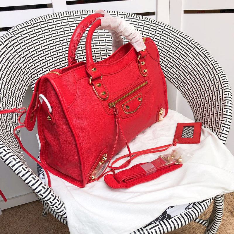 Handle and strap detail of polished statement women's handbag – women's designer-style accessory