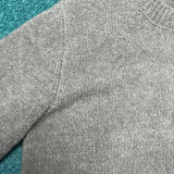 Close-up detail shot of Louis Vuitton luxury clothing with label-forward styling