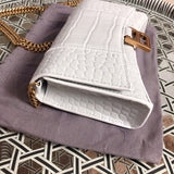 Back view of chic polished women's handbag – women's statement bag