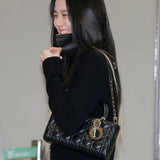 Front view of elevated modern women's handbag – women's luxury accessory