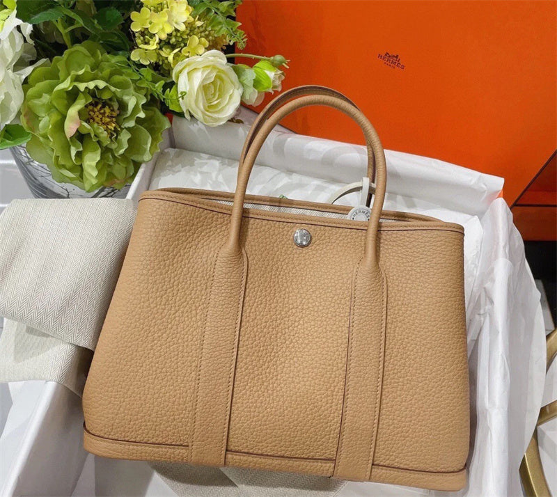Side view of tailored structured handbag
