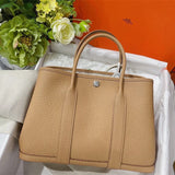 Side view of tailored structured handbag