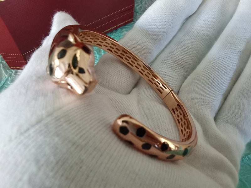 Side view of Cartier unisex jewelry piece