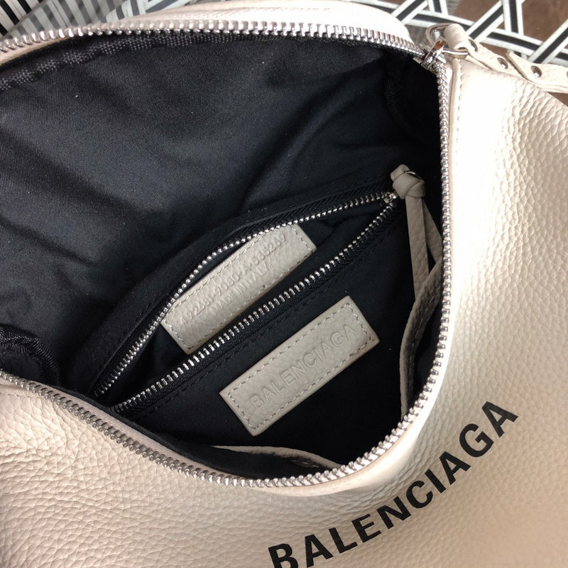 Side profile of everyday-luxe signature women's handbag – women's luxury accessory