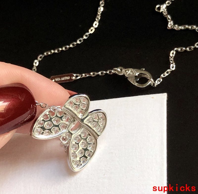 Lifestyle view of Van Cleef & Arpels unisex jewelry piece