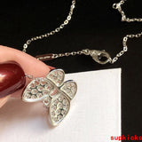 Lifestyle view of Van Cleef & Arpels unisex jewelry piece