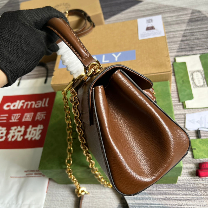 Styled lifestyle shot of signature sleek women's handbag – women's statement bag