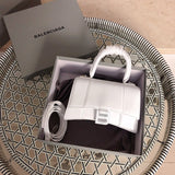 Side profile of chic elevated women's handbag – women's statement bag