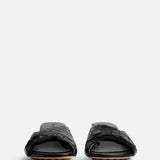 Close-up of Bottega Veneta flats hardware and fine stitching