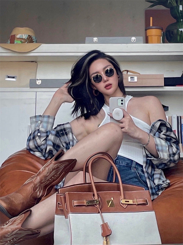 Side view of refined structured handbag