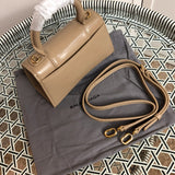 Styled lifestyle shot of modern sleek women's handbag – women's luxury accessory
