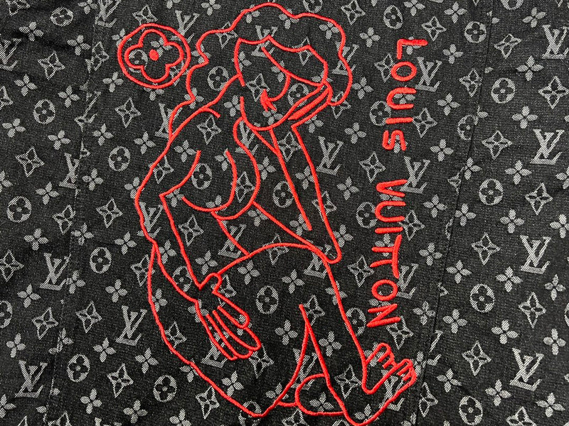 Flat lay presentation of Louis Vuitton luxury clothing with signature branding